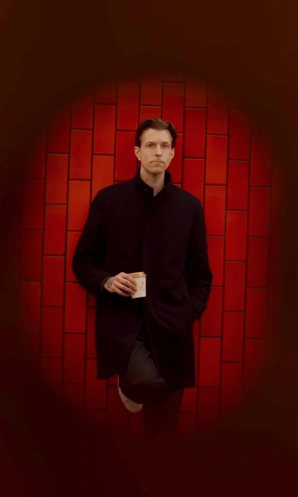 Christopher Alspach, co-founder and Director of Coffee of Oval Coffee Roasters, photographed at the Bowling Green subway station in Lower Manhattan, New York City, holding Oval’s women-produced light-roast coffee roasted in the Bronx.