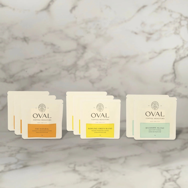 Oval Coffee Roasters mixed caddy sleeves. Single-serve pour over. Woman-grown, natural-process, and half-caff coffee.
