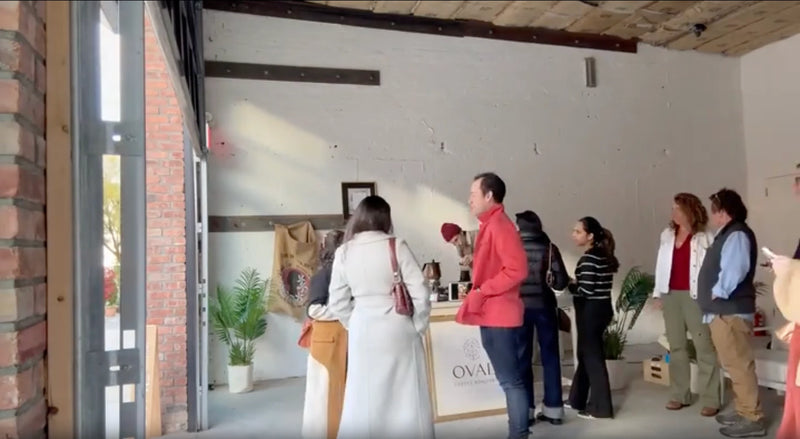 Guests gather at an Oval Coffee Roasters pop-up counter in a bright Brooklyn loft near the Navy Yard, with an Oval sign and coffee equipment visible, from the Oval Sundays timelapse thumbnail.