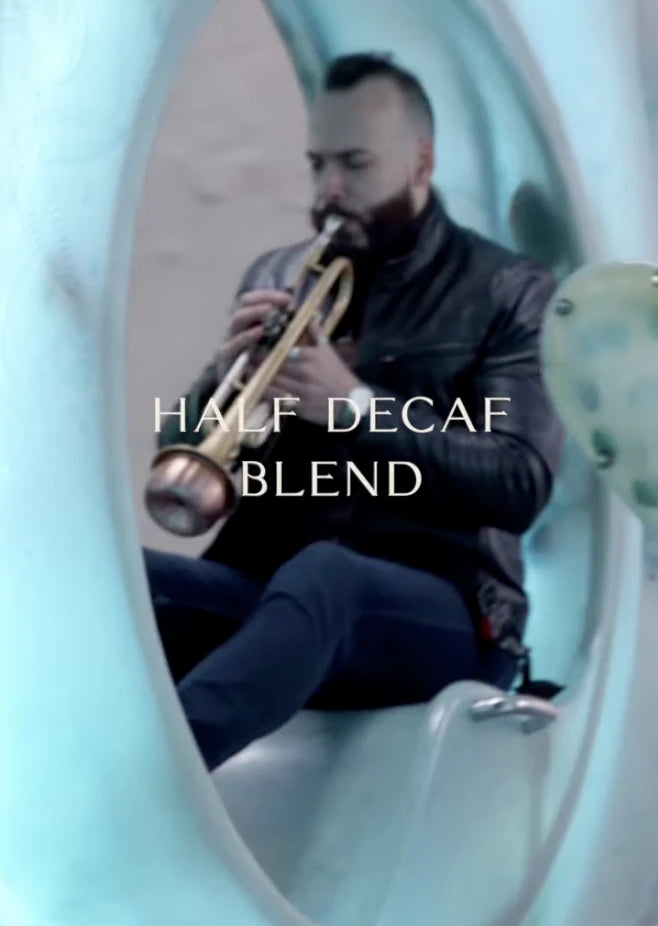 Oval Coffee Roasters Riverside Blend Half-Caff descriptor and the SeaGlass Carousel in Battery Park, New York City, with Grammy award winning  trumpeter Dr. Jonathan Saraga 