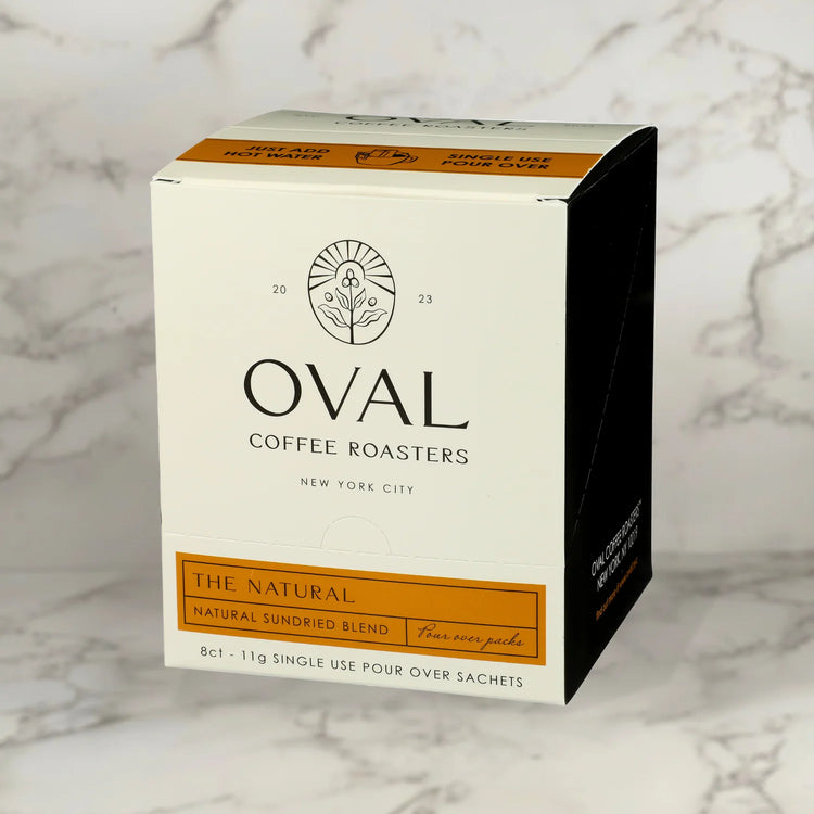 Oval Coffee Roasters The Natural single-serve pour-over drip filter bags (8-pack multipack), naturally processed light roast coffee roasted in New York City, featuring an innovative no-equipment drip filter for brewing anywhere